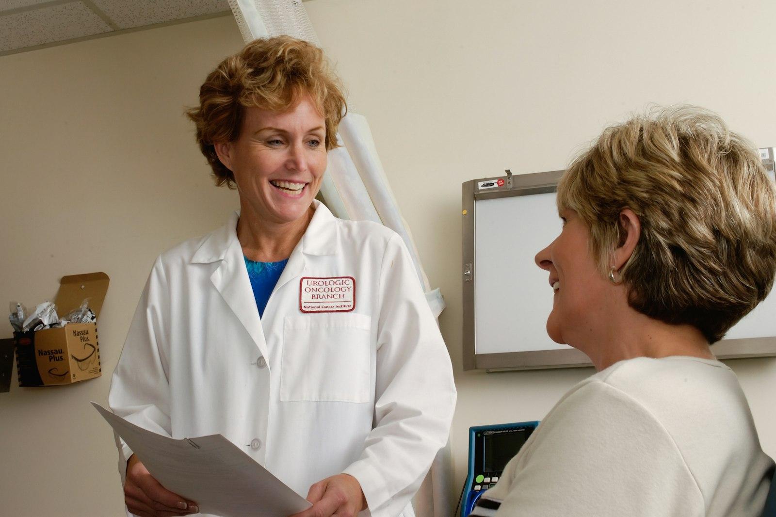Consultant reviewing compliance documents with a practice manager